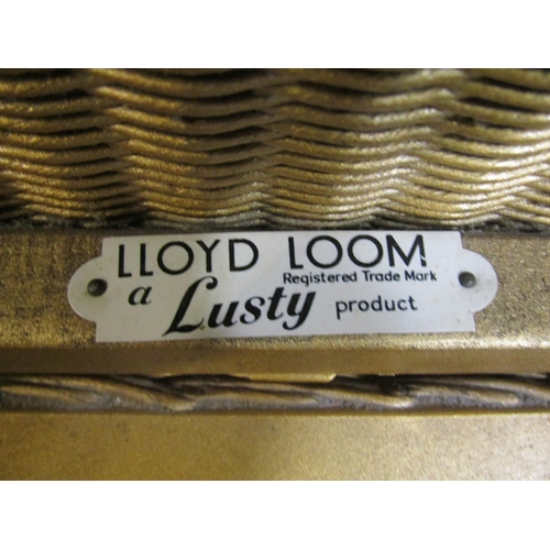 2231 - Three Lloyd Loom items with a gold painted finish, to include a chair, ottoman and laundry box toget... 