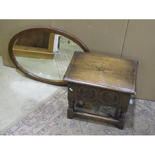 2233 - A carved oak work box in the old English style  and an oak wall mirror (2)