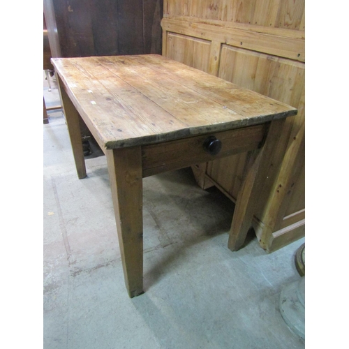 2242 - A small rustic scrubbed, pine farmhouse table, with planks top above a single frieze drawer, 71 cm h... 