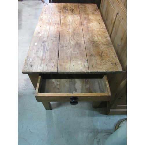 2242 - A small rustic scrubbed, pine farmhouse table, with planks top above a single frieze drawer, 71 cm h... 