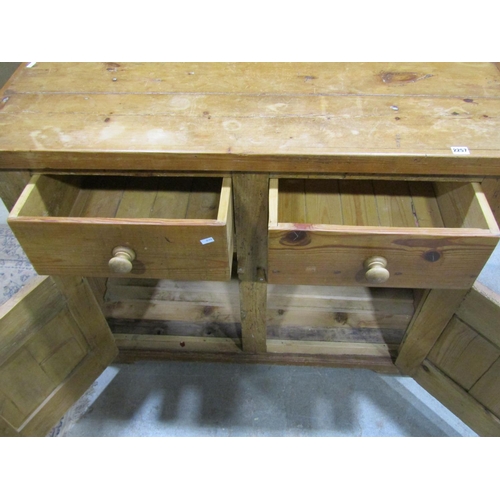 2257 - An old stripped pine dresser base, fitted with a pair of drawers and panelled doors, 92cm high, 120 ... 