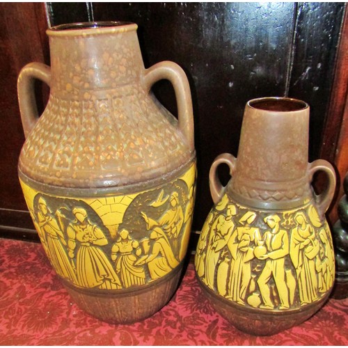 1076 - Two large mid 20th century twin handled West German ceramic vessels, decorated with stylised figural... 