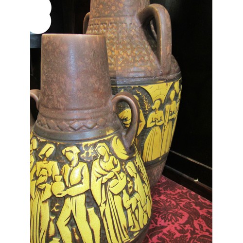 1076 - Two large mid 20th century twin handled West German ceramic vessels, decorated with stylised figural... 