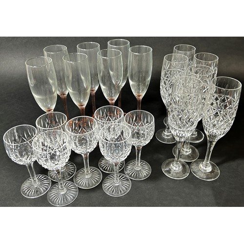 1139 - Ten Champagne flutes on slender pink stems, further flutes and wine glasses, decanters, jug, etc