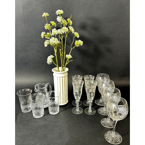 1139 - Ten Champagne flutes on slender pink stems, further flutes and wine glasses, decanters, jug, etc