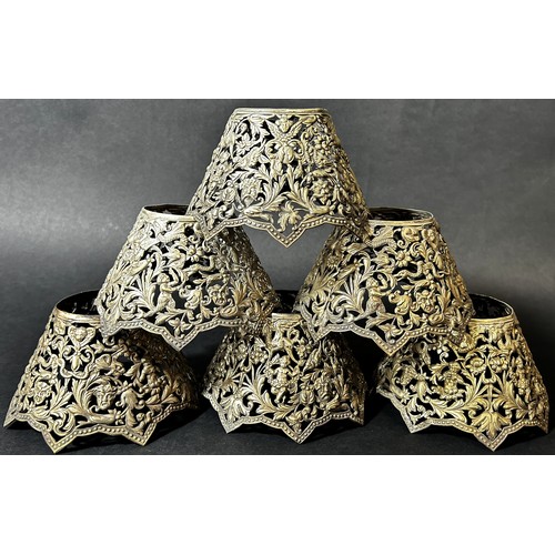 1154 - Six white metal pierced candlestick light shades with embossed and engraved Bacchanalian scenes of m... 