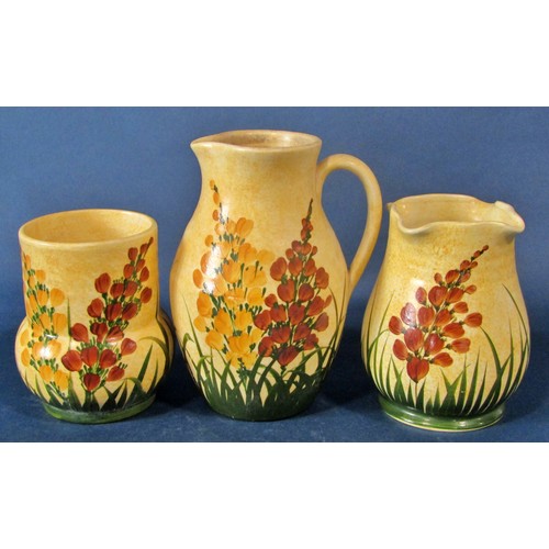 1088 - A collection of Radford pottery items to include jugs, vases, bowls, all decorated throughout with b... 