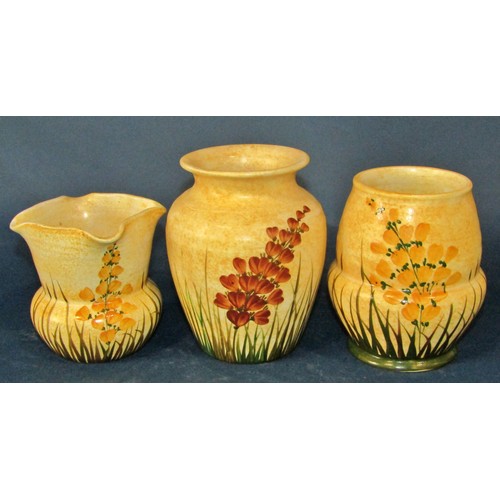 1088 - A collection of Radford pottery items to include jugs, vases, bowls, all decorated throughout with b... 