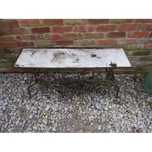 2049 - An ironwork and potting table/plant stand with scrolling supports, 58 cm high, 114 x,32 cm