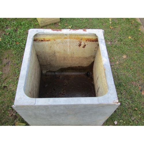 2056 - A large, galvanised water tank of square form, 61 cm high, 58 x 62 cm