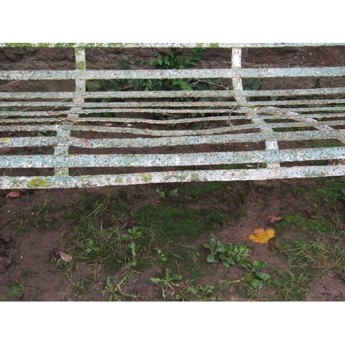 2064 - A good painted and weathered 19th century iron strapwork garden bench with simple open scrolled arms... 