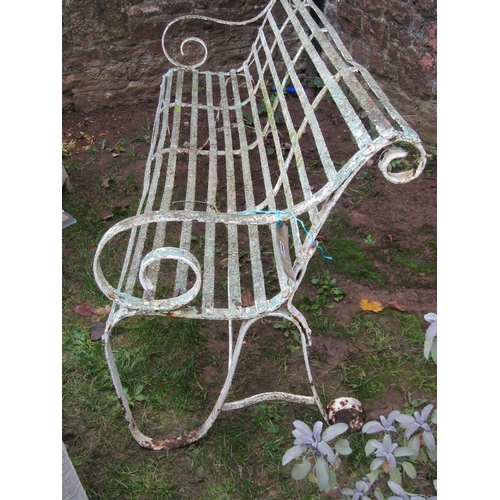 2064 - A good painted and weathered 19th century iron strapwork garden bench with simple open scrolled arms... 