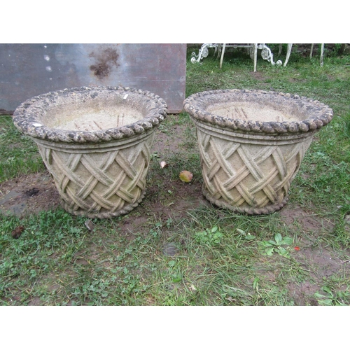 2068 - A pair of  weathered good quality cast composition stone garden planters in the form of circular bas... 