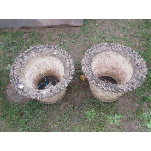 2068 - A pair of  weathered good quality cast composition stone garden planters in the form of circular bas... 