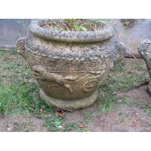 2068A - A pair of weathered cast composition stone circular garden planters in the form of Roman urns with r... 