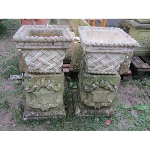 2071 - A pair of weathered cast composition stone square tapered planters in the form of lattice baskets wi... 