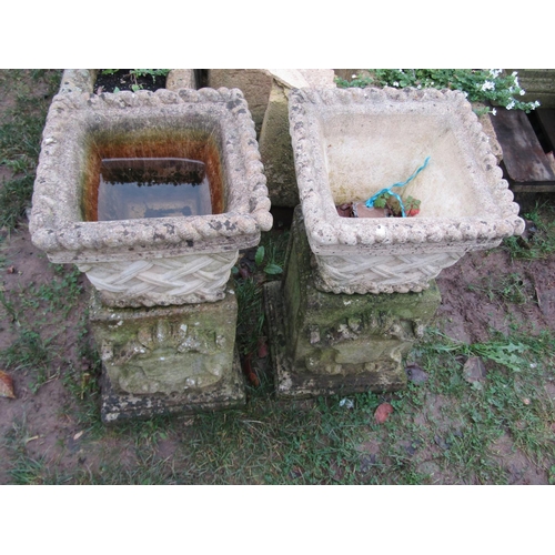 2071 - A pair of weathered cast composition stone square tapered planters in the form of lattice baskets wi... 