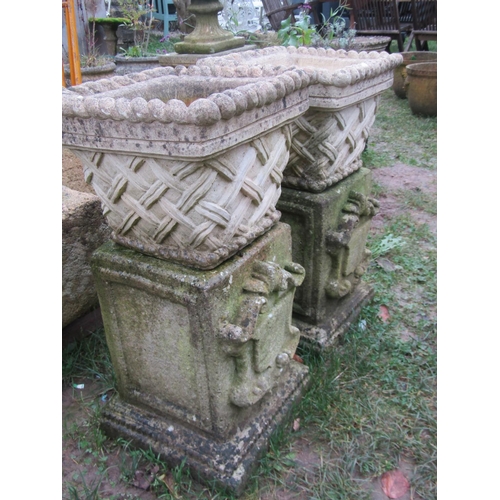 2071 - A pair of weathered cast composition stone square tapered planters in the form of lattice baskets wi... 