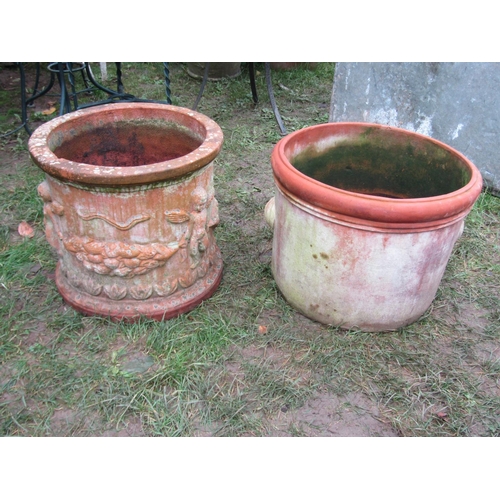 2081 - A weathered squat cylindrical terracotta planter with repeating raised relief winged cherub and frui... 