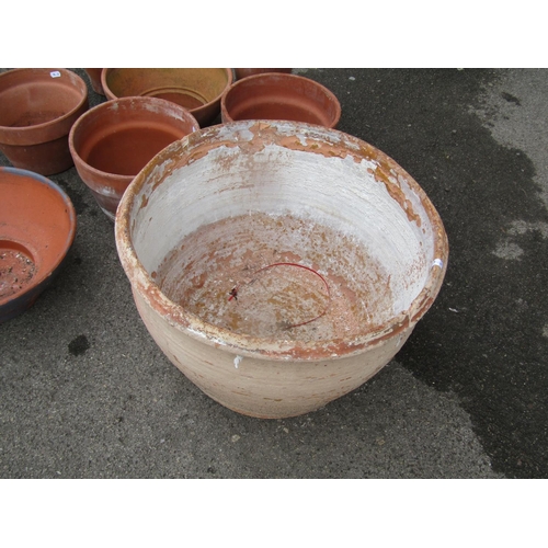 2096 - A weathered terracotta planter of squat circular form (af) 51cm diameter x 31cm high together with s... 