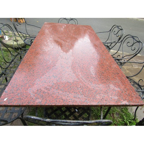 2080 - A heavy gauge ironwork garden suite comprising table with additional polished rectangular marble pos... 