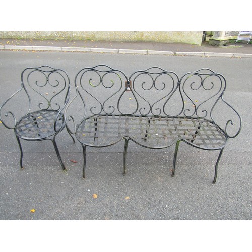 2080 - A heavy gauge ironwork garden suite comprising table with additional polished rectangular marble pos... 