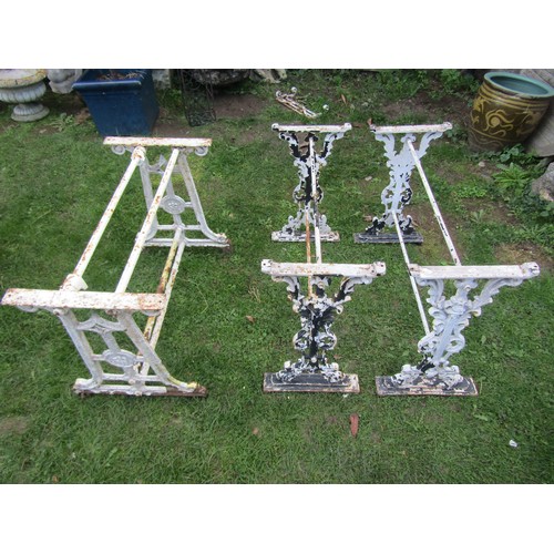 2085 - A pair of cast iron table bases, 67cm high, 36 x 96 together with another 65cm high, 44 x 91cm (3)