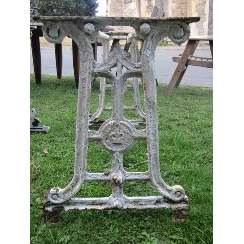 2085 - A pair of cast iron table bases, 67cm high, 36 x 96 together with another 65cm high, 44 x 91cm (3)