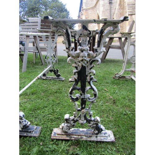 2085 - A pair of cast iron table bases, 67cm high, 36 x 96 together with another 65cm high, 44 x 91cm (3)