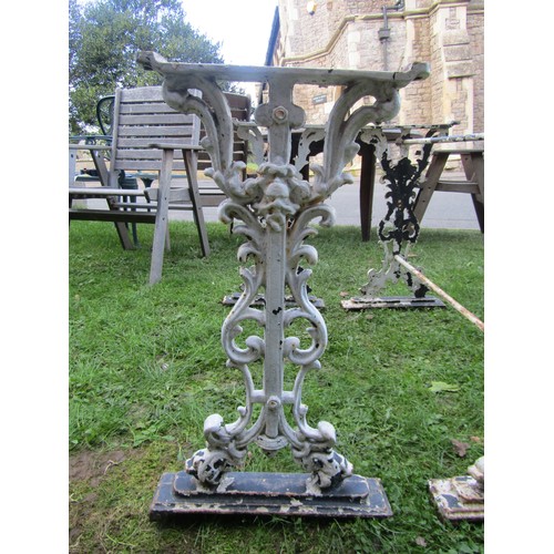 2085 - A pair of cast iron table bases, 67cm high, 36 x 96 together with another 65cm high, 44 x 91cm (3)