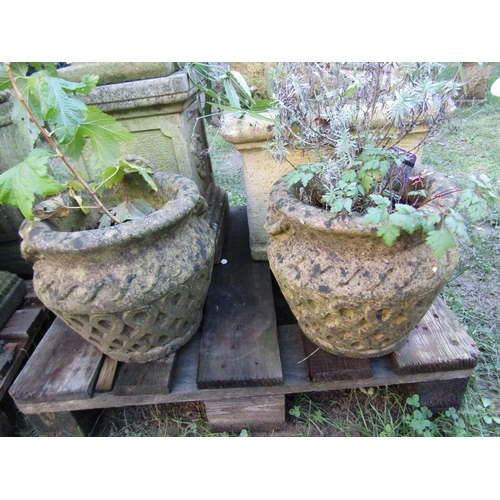 2074 - A weathered cast composition stone garden urn the circular lobed bowl with egg and dart flared rim r... 