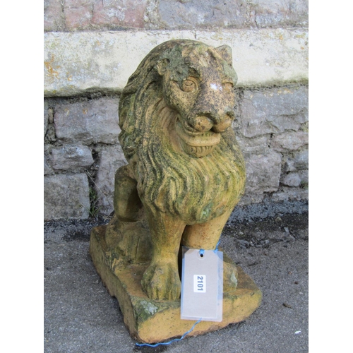 2101 - A weathered buff coloured garden terrace/pier ornament in the form of a seated lion (af), 52 cm high... 