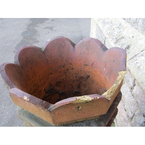 2115 - A pair of 19th century, moulded, terracotta chimney pots with geometric panelled motifs, 74cm high.