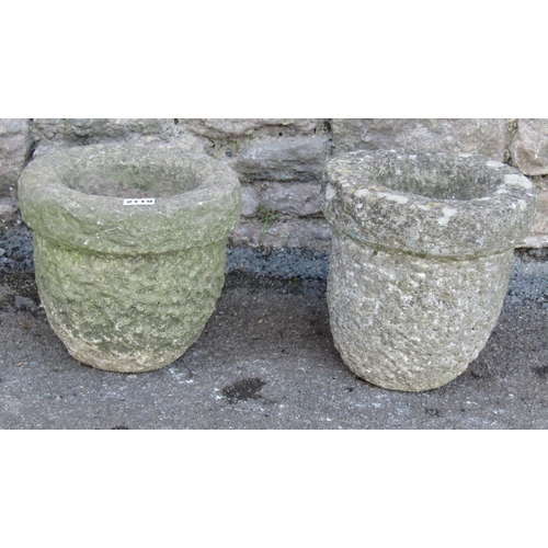 2119 - A pair of small weathered hewn natural limestone flower pots / planters, 23cm high