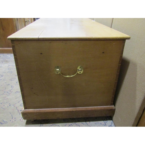 2195 - A large pale pine linen trunk / coffer, with brass carrying handles, 51cm high, 25 x 55cm.