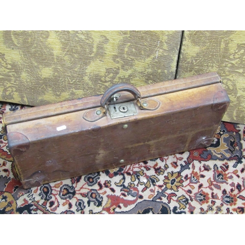 2663 - 19th century leather gun case with partially fitted interior, 64cm long
together with a contemporary... 