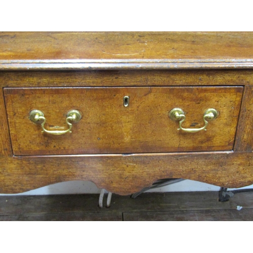 2717 - A Georgian oak cottage dresser fitted with three frieze drawers, shaped apron and four legs. The pla... 