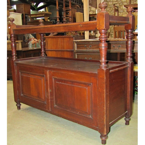 2221A - A Victorian walnut two tier buffet, partially enclosed by a pair of rectangular fielded panelled doo... 