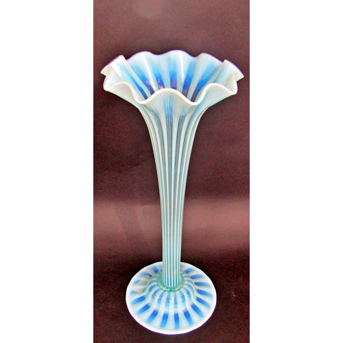 1117 - A Charles Kempton pale blue green ribbed trumpet Art Glass tall vase, on a spread base, 48cm tall.