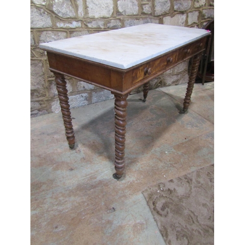 2207 - A late 19th century marble-topped satinwood table, fitted with twin frieze drawers, raised on twiste... 