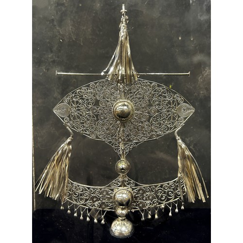 1192 - A very fine filigree wire work silver section of a Malay bridal crown, 17 cm high, set in a perspex ... 