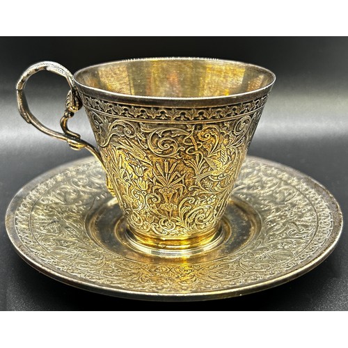 1173 - A French tea cup and saucer, with all over engraved bird and floral decoration, stamped Deposé to th... 