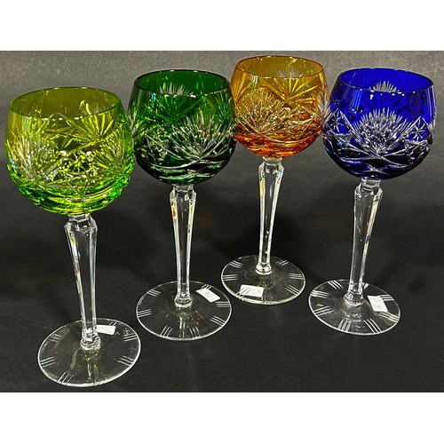 1107 - Four multicoloured cut glass hock glasses, blue, dark green, light green and amber, on slender hexag... 