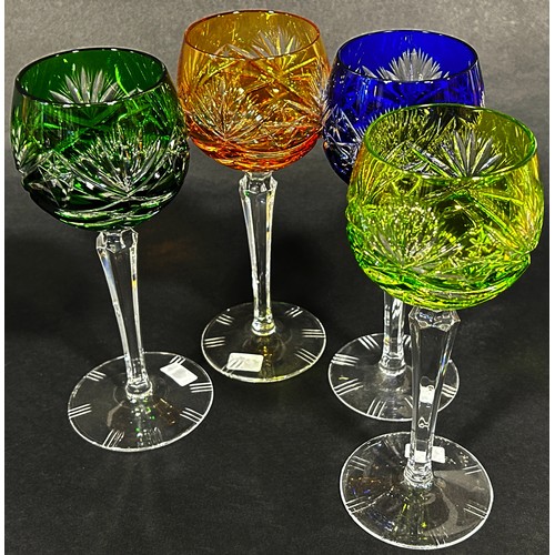 1107 - Four multicoloured cut glass hock glasses, blue, dark green, light green and amber, on slender hexag... 