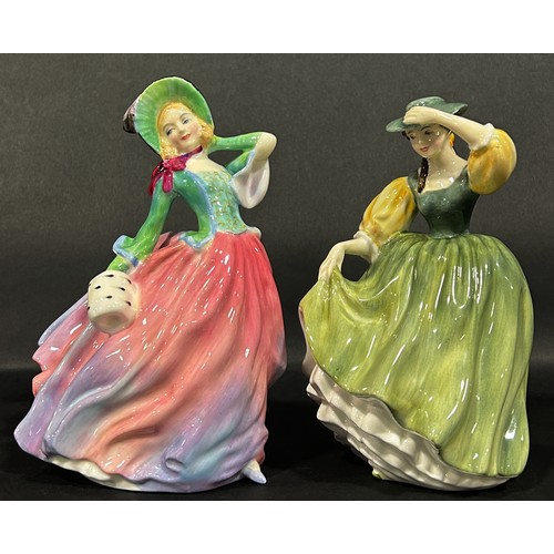 1069 - Three Doulton figures of ladies, Autumn Breezes, Buttercup and Daydream