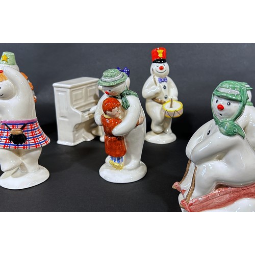 1085 - A 12 piece Royal Doulton 'Snowman' figures, band, drummer, snow balling, etc