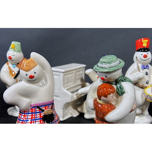 1085 - A 12 piece Royal Doulton 'Snowman' figures, band, drummer, snow balling, etc