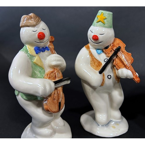 1085 - A 12 piece Royal Doulton 'Snowman' figures, band, drummer, snow balling, etc