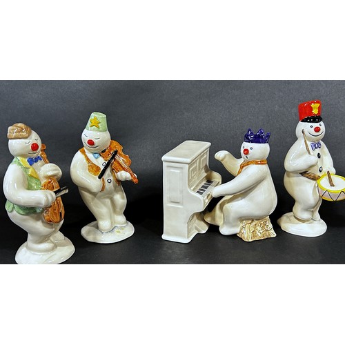 1085 - A 12 piece Royal Doulton 'Snowman' figures, band, drummer, snow balling, etc