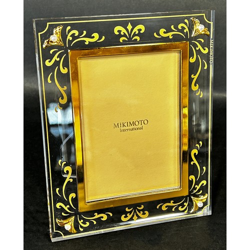 A Mikimoto International gilded photo frame with pearls to the